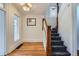 Hallway with hardwood floors, a decorative staircase, and a stained-glass window at 1474 Clayton St, Denver, CO 80206