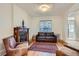 Cozy living room features a decorative fireplace and comfortable seating arrangement at 1474 Clayton St, Denver, CO 80206