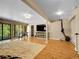 Finished basement featuring a game area, sliding door, and TV setup at 11768 Black Hawk Dr, Conifer, CO 80433