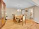 Traditional dining room with wood floors, chandelier, and elegant furniture at 11768 Black Hawk Dr, Conifer, CO 80433