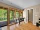 Game room features hardwood floors and a sliding glass door to the outdoor deck with scenic views at 11768 Black Hawk Dr, Conifer, CO 80433