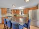 Modern kitchen with large island, stainless steel appliances, and seating at 11768 Black Hawk Dr, Conifer, CO 80433