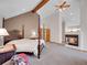 Spacious main bedroom with a fireplace and comfortable decor at 11768 Black Hawk Dr, Conifer, CO 80433