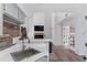 Well-lit kitchen with stainless steel sink, brick wall accent, and white countertops at 4824 E Kentucky Ave # F, Denver, CO 80246