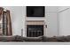 Living room with fireplace and mounted TV at 4824 E Kentucky Ave # F, Denver, CO 80246