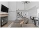 Bright living room features fireplace, vaulted ceilings, and open floor plan at 4824 E Kentucky Ave # F, Denver, CO 80246