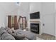 Bright living room with vaulted ceilings, flatscreen, and a stone fireplace at 4824 E Kentucky Ave # F, Denver, CO 80246