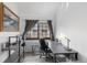 Home office with a large window, gray desk, and gray shelves at 4824 E Kentucky Ave # F, Denver, CO 80246