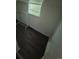 Bedroom with vinyl flooring and a window at 1272 N Ulster St, Denver, CO 80220
