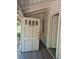 Front porch entrance with a decorative front door with the house number 1272 at 1272 N Ulster St, Denver, CO 80220