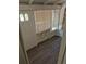 Covered porch entrance featuring wood laminate flooring, and windows with blinds at 1272 N Ulster St, Denver, CO 80220