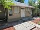 Exterior of the house with painted beige and white trim and front door with the house number 1272 at 1272 N Ulster St, Denver, CO 80220