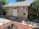 Exterior of the house with painted beige and white trim and front door with the house number 1272 at 1272 N Ulster St, Denver, CO 80220