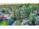 An aerial view showcasing a home embraced by lush greenery, offering a sense of privacy and natural beauty at 9416 Mcshane Ct, Parker, CO 80134