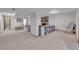 Spacious basement with a brick fireplace, neutral carpet, and a comfortable seating area at 9416 Mcshane Ct, Parker, CO 80134