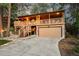 Inviting two-story home featuring a charming covered porch and a convenient two-car garage at 9416 Mcshane Ct, Parker, CO 80134