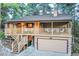 Inviting two-story home featuring a charming covered porch and a convenient two-car garage at 9416 Mcshane Ct, Parker, CO 80134