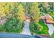 A charming single-Gathering home with a well-maintained driveway and an inviting deck surrounded by lush trees at 9416 Mcshane Ct, Parker, CO 80134