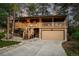 Inviting two-story home featuring a charming covered porch and a convenient two-car garage at 9416 Mcshane Ct, Parker, CO 80134