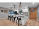 Bright kitchen featuring an oversized island with bar stool seating at 9416 Mcshane Ct, Parker, CO 80134