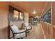Relaxing covered porch with comfortable seating and an outdoor dining area at 9416 Mcshane Ct, Parker, CO 80134