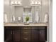 Bathroom featuring double vanity, tile backsplash, and vessel sink at 22978 E Bailey Cir, Aurora, CO 80016