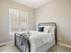 Bedroom with metal bed frame and bright natural light at 22978 E Bailey Cir, Aurora, CO 80016
