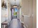 Warm and inviting hallway with hardwood flooring and decorative touches, showcasing a view to the front yard at 22978 E Bailey Cir, Aurora, CO 80016