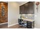 Functional home office with custom built-ins, granite countertop, and stylish accent wall, perfect for remote work at 22978 E Bailey Cir, Aurora, CO 80016