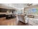 Open-concept living space with a modern kitchen, expansive island, and comfortable seating area, great for entertaining at 22978 E Bailey Cir, Aurora, CO 80016