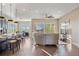 Bright and airy living space flowing from the kitchen with counter seating to the comfortable seating area at 22978 E Bailey Cir, Aurora, CO 80016