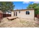 Backyard featuring a small raised platform and some sparse greenery at 8401 Sandreed Cir, Parker, CO 80134