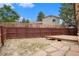 Backyard with a wood fence and a raised platform at 8401 Sandreed Cir, Parker, CO 80134