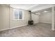 Finished basement with a charming wood-burning stove and wood-look flooring at 8401 Sandreed Cir, Parker, CO 80134