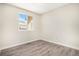 Cozy bedroom with wood-look flooring, natural light and neutral wall paint at 8401 Sandreed Cir, Parker, CO 80134