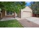 Charming single-Gathering home featuring a two-car garage and a well-manicured lawn at 8401 Sandreed Cir, Parker, CO 80134
