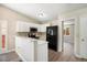 Modern kitchen featuring white cabinets, stainless steel appliances, and an open design concept at 8401 Sandreed Cir, Parker, CO 80134