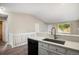 Kitchen with a view into the living room, features stainless steel appliances and lots of light at 8401 Sandreed Cir, Parker, CO 80134