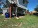 Backyard of house with a satellite dish, and outdoor sitting area underneath an elevated deck at 11502 E 7Th E Ave, Aurora, CO 80010