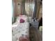 Inviting bedroom featuring warm lighting, a soft bed, and a cozy ambiance at 11502 E 7Th E Ave, Aurora, CO 80010