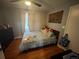 Comfortable bedroom with hardwood floors, soft natural light and ample closet space at 11502 E 7Th E Ave, Aurora, CO 80010