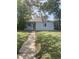 Charming single-story home featuring a well-maintained lawn and inviting walkway to front door at 11502 E 7Th E Ave, Aurora, CO 80010