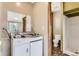 Cozy kitchenette with a combination sink and stove top, toilet and shower at 11502 E 7Th E Ave, Aurora, CO 80010