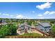 An aerial view of the home showcasing its landscaped backyard, cozy deck, and surrounding neighborhood at 16863 Trail View Cir, Parker, CO 80134