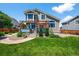 Serene backyard with lush lawn, inviting patio area, and mature landscaping, creating a peaceful retreat at 16863 Trail View Cir, Parker, CO 80134