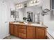 Well-lit bathroom with double sinks, a large mirror, and a separate shower and tub at 16863 Trail View Cir, Parker, CO 80134
