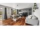 An open-concept dining and living area features a fireplace, built-in shelving, and abundant natural light at 16863 Trail View Cir, Parker, CO 80134