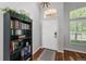 Inviting entryway with hardwood floors, a bookcase, and natural light, creating a warm welcome at 16863 Trail View Cir, Parker, CO 80134