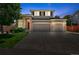 Charming two-story home with a brick facade, manicured lawn, and a two-car garage, perfect for a growing Gathering at 16863 Trail View Cir, Parker, CO 80134