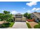 Attractive two-story home with a brick-accented facade, three-car garage, and landscaped front yard at 16863 Trail View Cir, Parker, CO 80134